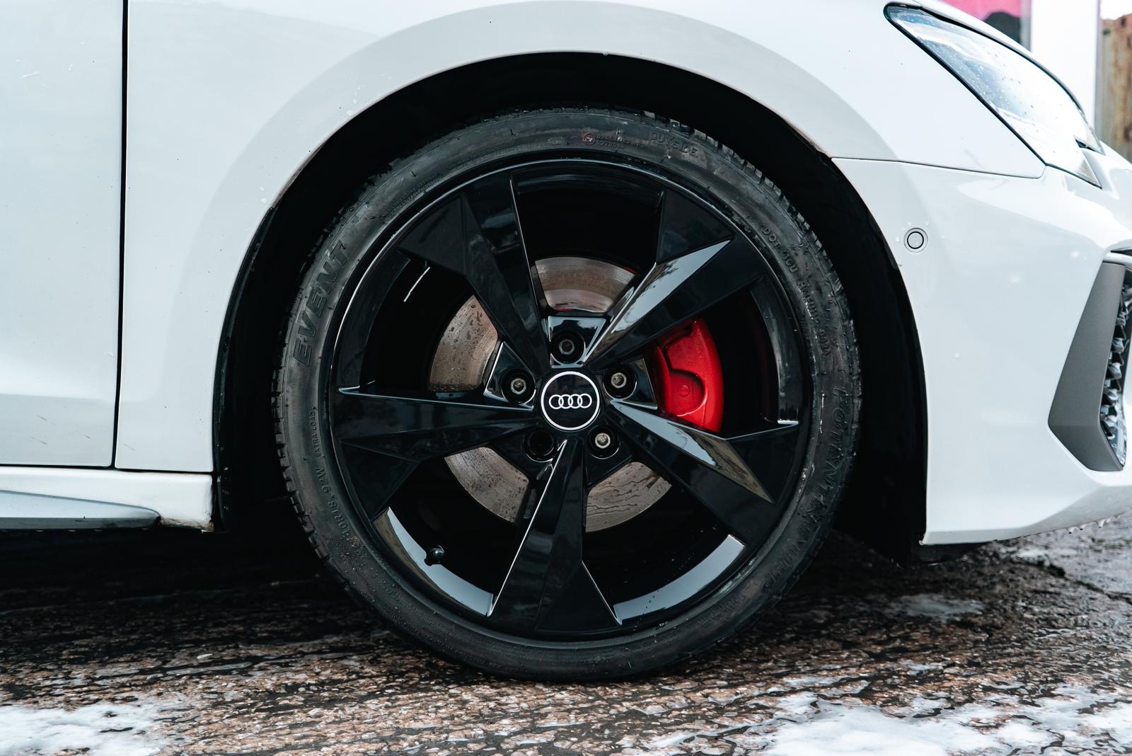 Refinished alloy wheel with restored gloss coating